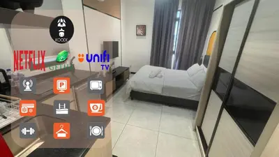 a room with a bedroom with a bed and a mirror at KL City, Neu Suites 2Bedroom 2Bathroom in Kuala Lumpur