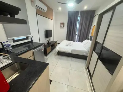 a room with a kitchen and a bed in a room at KL City, Neu Suites 2Bedroom 2Bathroom in Kuala Lumpur