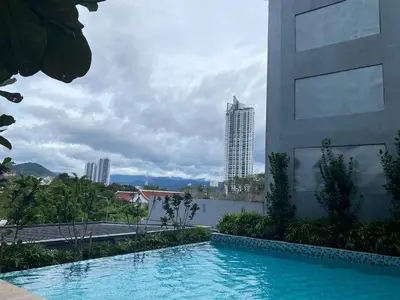 a swimming pool in front of a building at KL City, Neu Suites 2Bedroom 2Bathroom in Kuala Lumpur