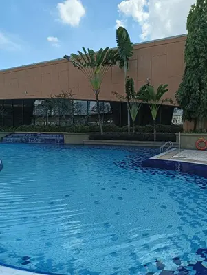 a large swimming pool in front of a building at Royal Service Suite At Berjaya Times Square in Kuala Lumpur