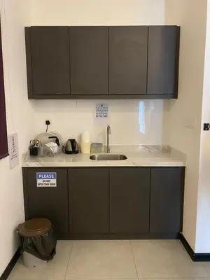 a kitchen with a sink and a counter top at Neu Suite by Triple A in Kuala Lumpur