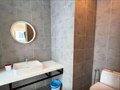 a bathroom with a sink and a mirror at park view one bedroom apartment klcc in Kuala Lumpur