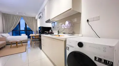a kitchen with a washing machine in a room at Majestic Residence sky pool 10mins to KLCC By Light House in Kuala Lumpur
