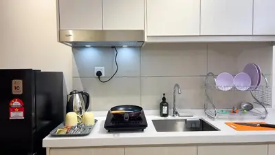 a kitchen counter with a sink and a toaster at Majestic Residence sky pool 10mins to KLCC By Light House in Kuala Lumpur