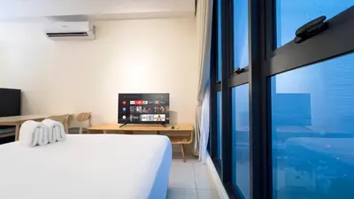 a bedroom with a bed and a desk and a window at Majestic Residence sky pool 10mins to KLCC By Light House in Kuala Lumpur
