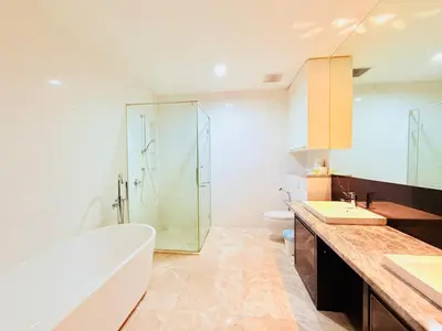 a bathroom with a tub and a shower and a sink at PLATINUM Suites KLCC at BBS in Kuala Lumpur