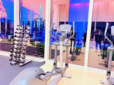 a gym with a bunch of exercise equipment in a store at PLATINUM Suites KLCC at BBS in Kuala Lumpur