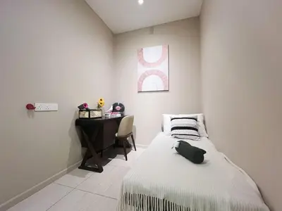 a small bedroom with a bed and a desk at Dorsett Hartamas Mont Kiara Kuala Lumpur Mitec by innfinitystay in Kuala Lumpur