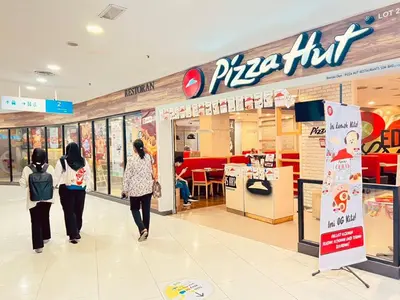 three people walking in a pizza store at Kuala Lumpur Suites Majestic Sky Pool in Kuala Lumpur