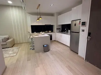 a kitchen with white cabinets and a white counter top at KL Star Residance KLCC by Nexus in Kuala Lumpur