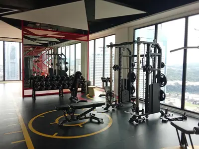 a gym with treadmills and weights in a building at Majestic Residence Kuala Lumpur in Kuala Lumpur