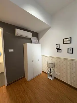 a room with a white refrigerator and a fan at Reizz Residence by Willow Trip in Kuala Lumpur