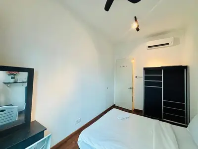 a small bedroom with a bed and a tv at Reizz Residence by Willow Trip in Kuala Lumpur