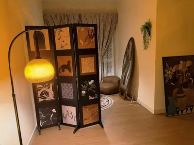 a room with a door with paintings and a lamp at Cheras KL Velocity Mall VR3 8pax MRT Maluri NAN JING STREET 焦赖吉隆坡 步行1分钟到 双威伟乐城&南京街 可容8人 in Kuala Lumpur