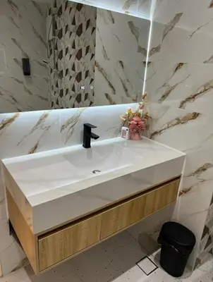 a bathroom with a white sink and a mirror at Parkview Serviced Apartment in Kuala Lumpur