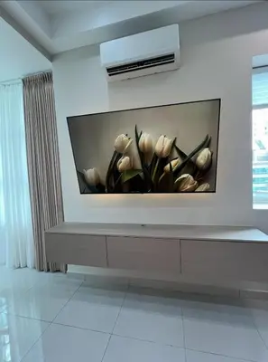 a wall with a vase of flowers on a wall at Parkview Serviced Apartment in Kuala Lumpur