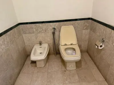 a bathroom with a toilet and a bidet at KL Suite at Times Square in Kuala Lumpur