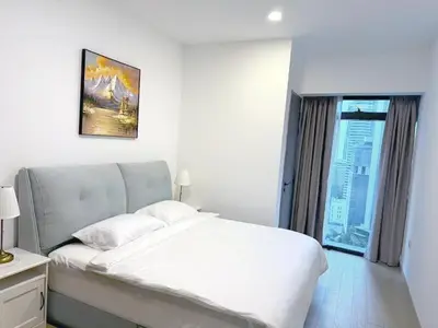 a bedroom with a white bed and a window at Eaton Hotel \u4f0a\u987f\u9152\u5e97 \u4e94\u661f\u7ea7\u9152\u5e97 in Kuala Lumpur
