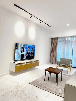a living room with a flat screen tv on a wall at Eaton Hotel \u4f0a\u987f\u9152\u5e97 \u4e94\u661f\u7ea7\u9152\u5e97 in Kuala Lumpur