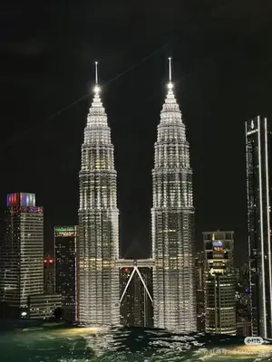 two tall buildings in a city at night at Eaton Hotel \u4f0a\u987f\u9152\u5e97 \u4e94\u661f\u7ea7\u9152\u5e97 in Kuala Lumpur