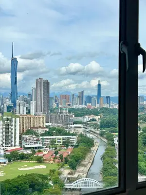a view of a city from a window at 3BR KL Sentral L27 Modern Vintage Views in Kuala Lumpur
