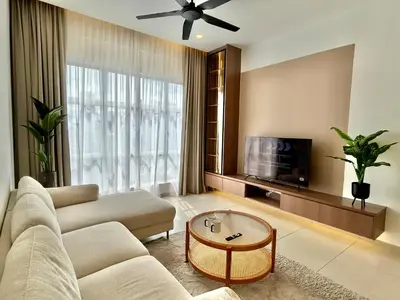 a living room with a couch and a tv at 3BR KL Sentral L27 Modern Vintage Views in Kuala Lumpur