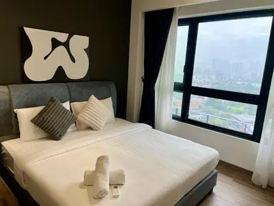 a bedroom with a bed with a large window at Agile Landmark Suites by Kuala Lampur City in Kuala Lumpur