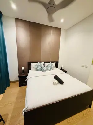a bedroom with a large bed with a ceiling at Lucentia Residence Skyline KL Stay in Kuala Lumpur