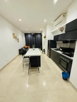 a kitchen with a table and some chairs and a stove at Lucentia Residence Skyline KL Stay in Kuala Lumpur