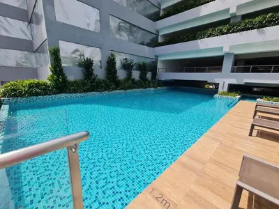 a large swimming pool in the middle of a building at Small Studio Neu Suites Gleneagles Ampang KL in Kuala Lumpur