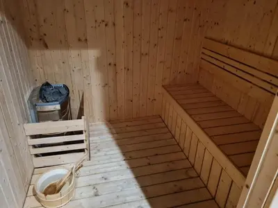 an empty wooden sauna with a toilet in it at Chillax Studio Near KLCC Gleneagles in Kuala Lumpur