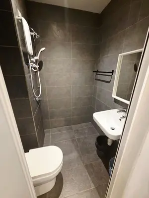 a bathroom with a toilet and a sink at Little Studio Neu Suites near KLCC in Kuala Lumpur