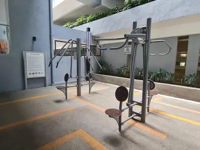 a row of gym equipment in a building at Little Studio Neu Suites near KLCC in Kuala Lumpur