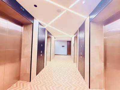 a corridor of elevators in a building with at Scarletz Luxury Suites KL in Kuala Lumpur