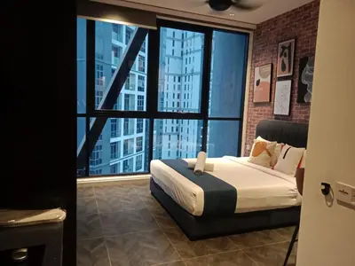 a bedroom with a bed and a large window at Scarletz Suites Klcc Twin tower by Lucky in Kuala Lumpur