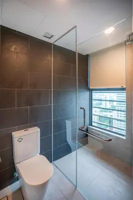 a bathroom with a toilet and a glass shower at Novo Ampang Residence Studio Close to KLCC and Gleneagles in Kuala Lumpur