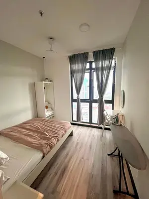 a bedroom with a bed and a large window at Comfort Stay Neusuite Jelatek in Kuala Lumpur