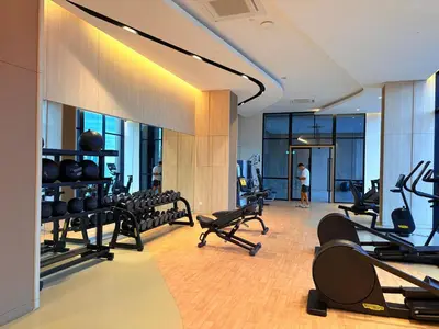 a gym with lots of treadmills and exercise bikes at The Axon Residence KLCC Suites Kuala Lumpur in Kuala Lumpur
