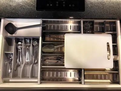 a drawer in an oven filled with utensils at The Axon Residence KLCC Suites Kuala Lumpur in Kuala Lumpur