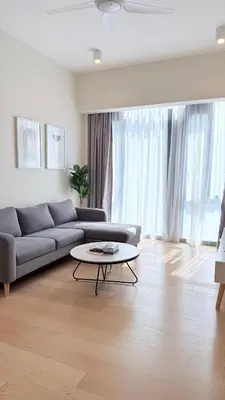 a living room with a couch and a table at Star Residences Apartment KLCC in Kuala Lumpur