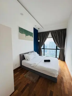 a bedroom with a large bed and a large window at Reizz Residence by Ampang Kiri in Kuala Lumpur