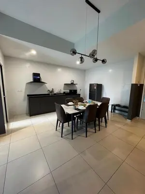 a dining room and kitchen with a table and chairs at Reizz Residence by Ampang Kiri in Kuala Lumpur