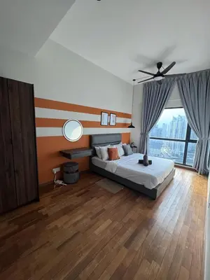 a bedroom with a bed and a ceiling fan at Reizz Residence by Ampang Kiri in Kuala Lumpur