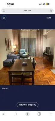 a living room with a table and a couch at Luxury Stay in Kuala Lumpur in Kuala Lumpur