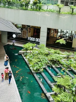 a group of people walking in a shopping mall at Regalia Apartments By FA 6 in Kuala Lumpur