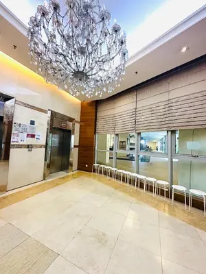 a large room with a chandelier in a building at Regalia Apartments By FA 6 in Kuala Lumpur