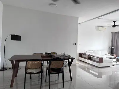 a dining room with a table and chairs and a bed at Tuan Residency in Kuala Lumpur