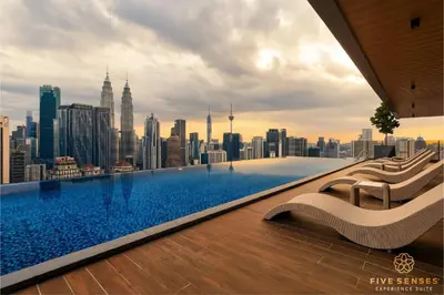 a swimming pool with a view of the city at Armani Residence Kuala Lumpur in Kuala Lumpur