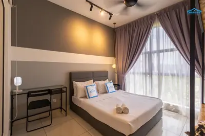 a bedroom with a bed with two slippers on it at Arte Mont Kiara Luxe Suites by Dream'Inn in Kuala Lumpur