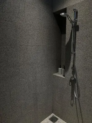 a shower in a bathroom with a shower head at Scarletz Suites KLCC Studio in Kuala Lumpur